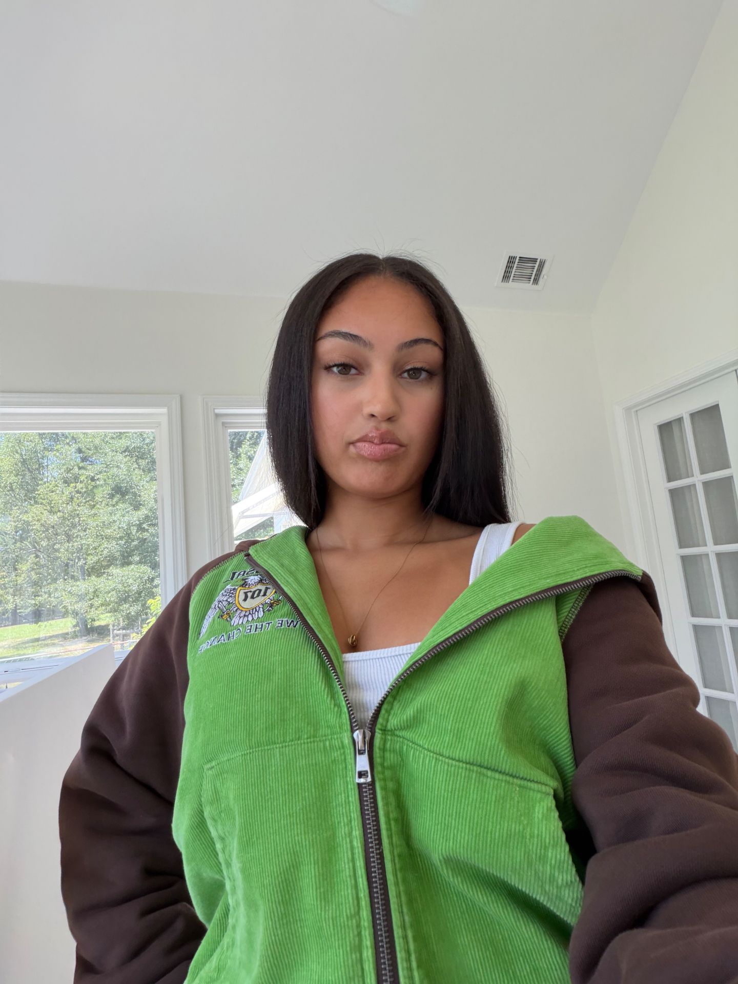 Green Mud zipper worn open, chest detail